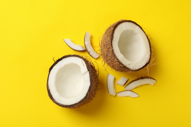 Group of tasty fresh coconut on yellow