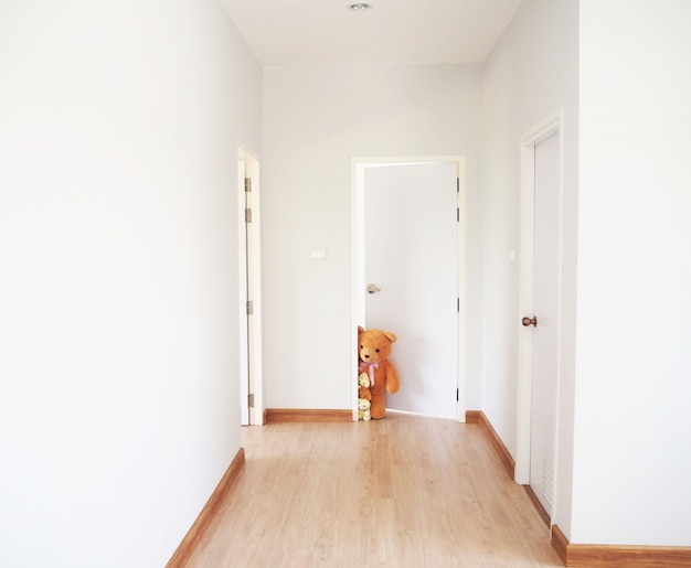 A group of teddy bears standing inside the house.