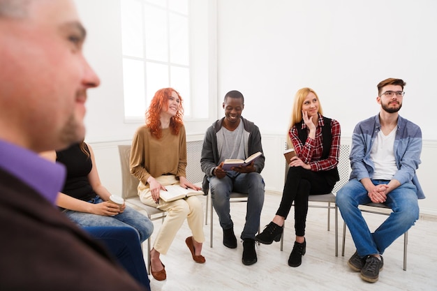 Group therapy. Multicultured group on psychology support meeting, copy space