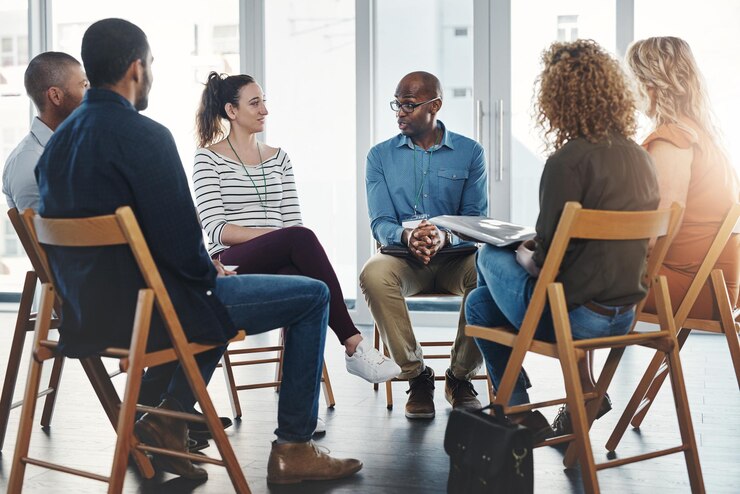 Photo a group therapy session with diverse people sharing their sad problems and stories people sitting in a circle talking about their mental health issues and looking for support help and counseling