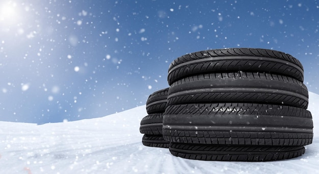 Group of tires in the middle of a snow filled race