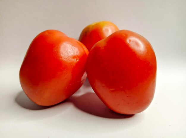 group of tomatoes isolated on white background