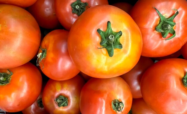 Group of tomatoes lying on a pile on top of each other tomato texture selective focus for content creation multimedia card creation