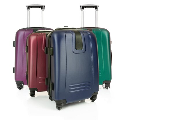 Group of various travel suitcases isolated on a white background