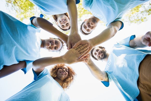 Group of volunteer forming huddles