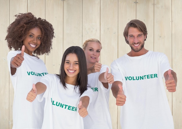 Photo group of volunteers showing thumbs up