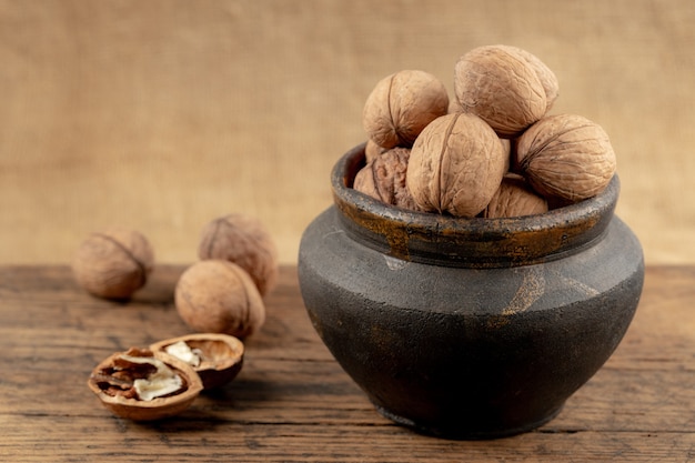 group of walnuts on a wooden background