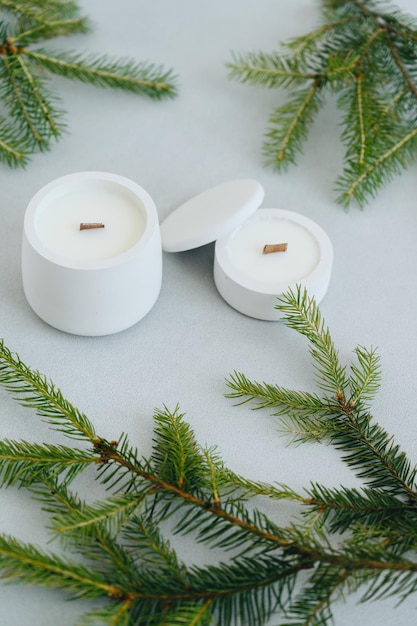 Group of White Candles of Various Sizes Top View Flat Lay Christmas Tree Branches and Candles