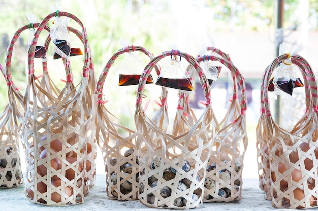 Group  Wicker round bamboo basket for quail eggs at local market in Thailand