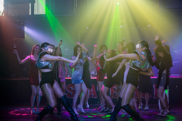 Group woman dancing in night party happy new year concept