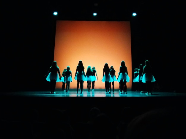 group of women dancing on stage