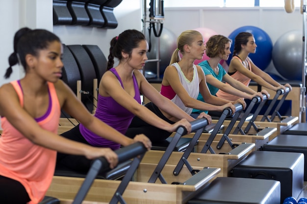 Group of women exercising on reformer