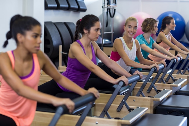 Group of women exercising on reformer