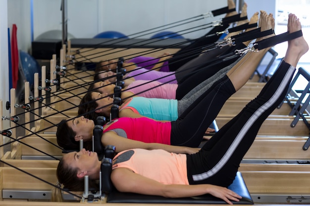 Group of women exercising on reformer