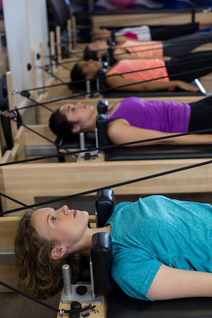 Group of women exercising on reformer