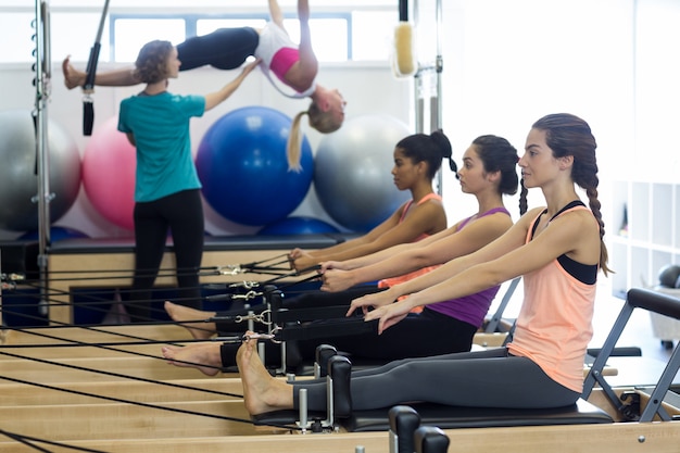 Group of women exercising on reformer