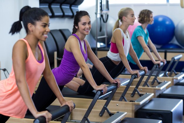 Group of women exercising on reformer