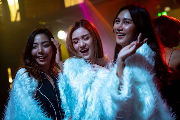 Group of women friend having fun at party in dancing club