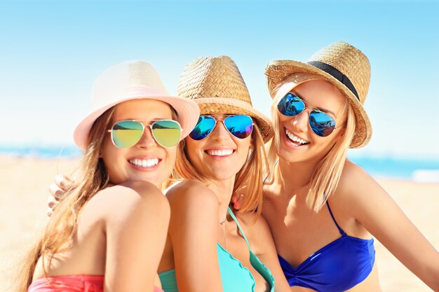 group of women having fun on the beach