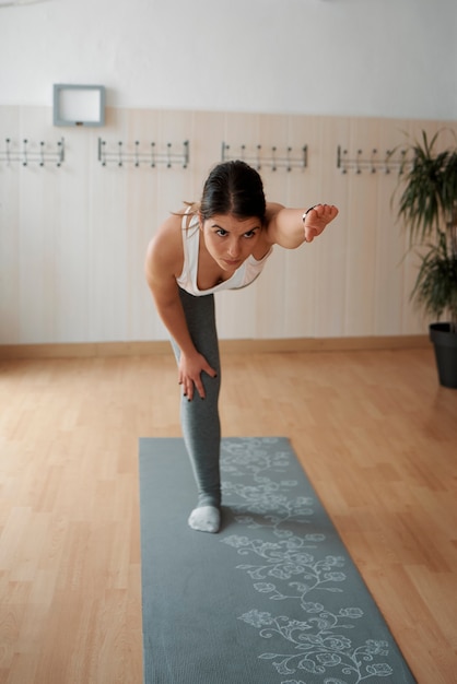 Group of women practicing Pilates exercises in class