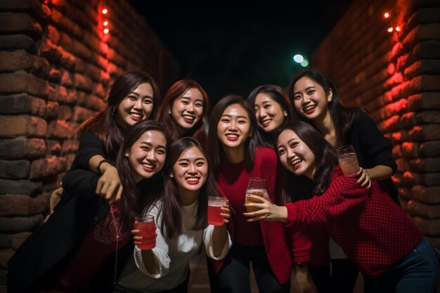 Photo a group of women standing next to each other holding wine glasses