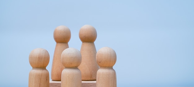 Group of wooden toy people standing together