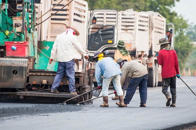 Group of worker repair road asphalting