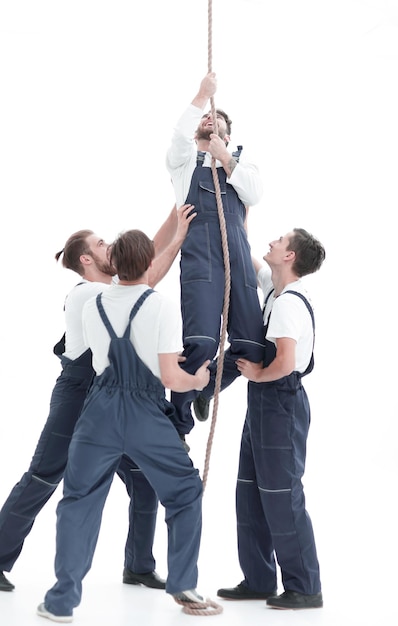 Group workers help the companion to climb up