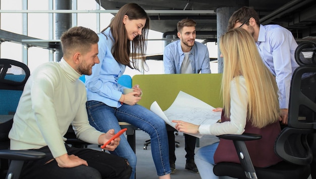 Group of young business people and designers in smart casual wear They working on new project