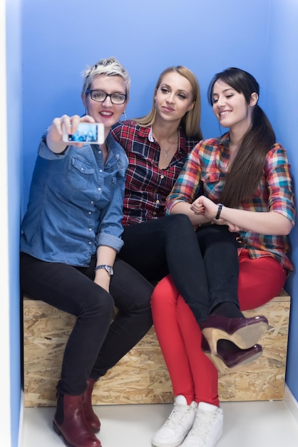 group of young business people having fun, relaxing and working in creative room space at modern startup office