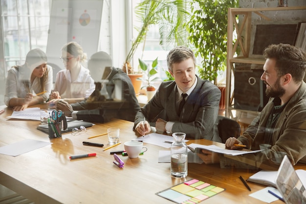 Group of young business professionals having a meeting, creative office