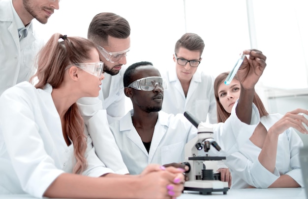 Group of young clinicians experimentation in research laboratory