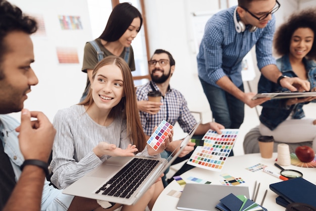 A group of young designers do brainstorming.