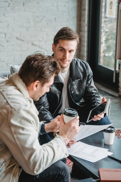 group of young entrepreneurs working together with people in the office people business meeting
