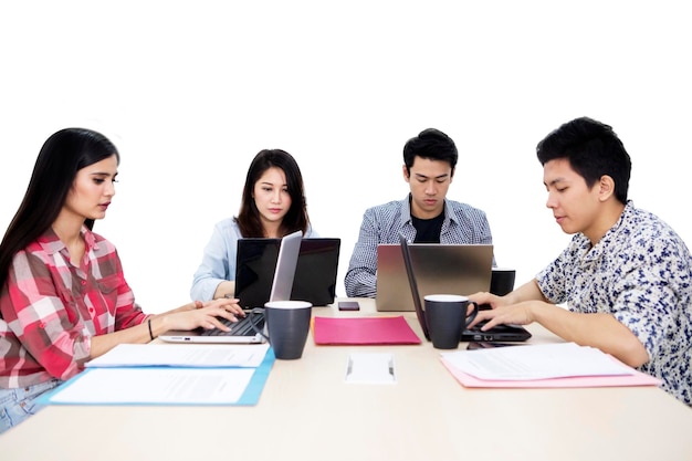 Group of young freelancers looks busy on studio