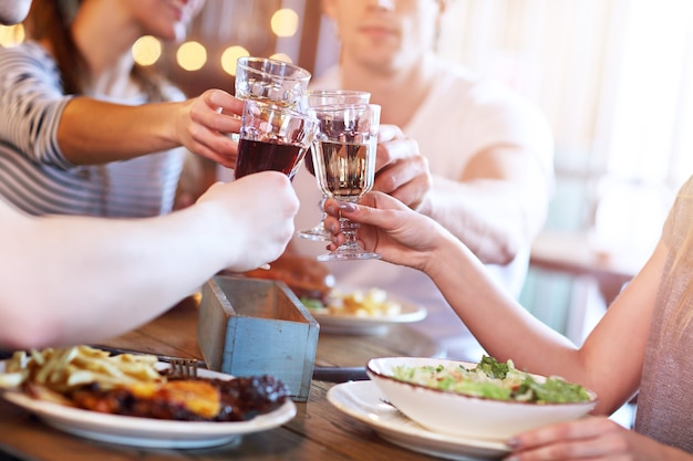 Group Of Young Friends Enjoying Meal In Restaurant