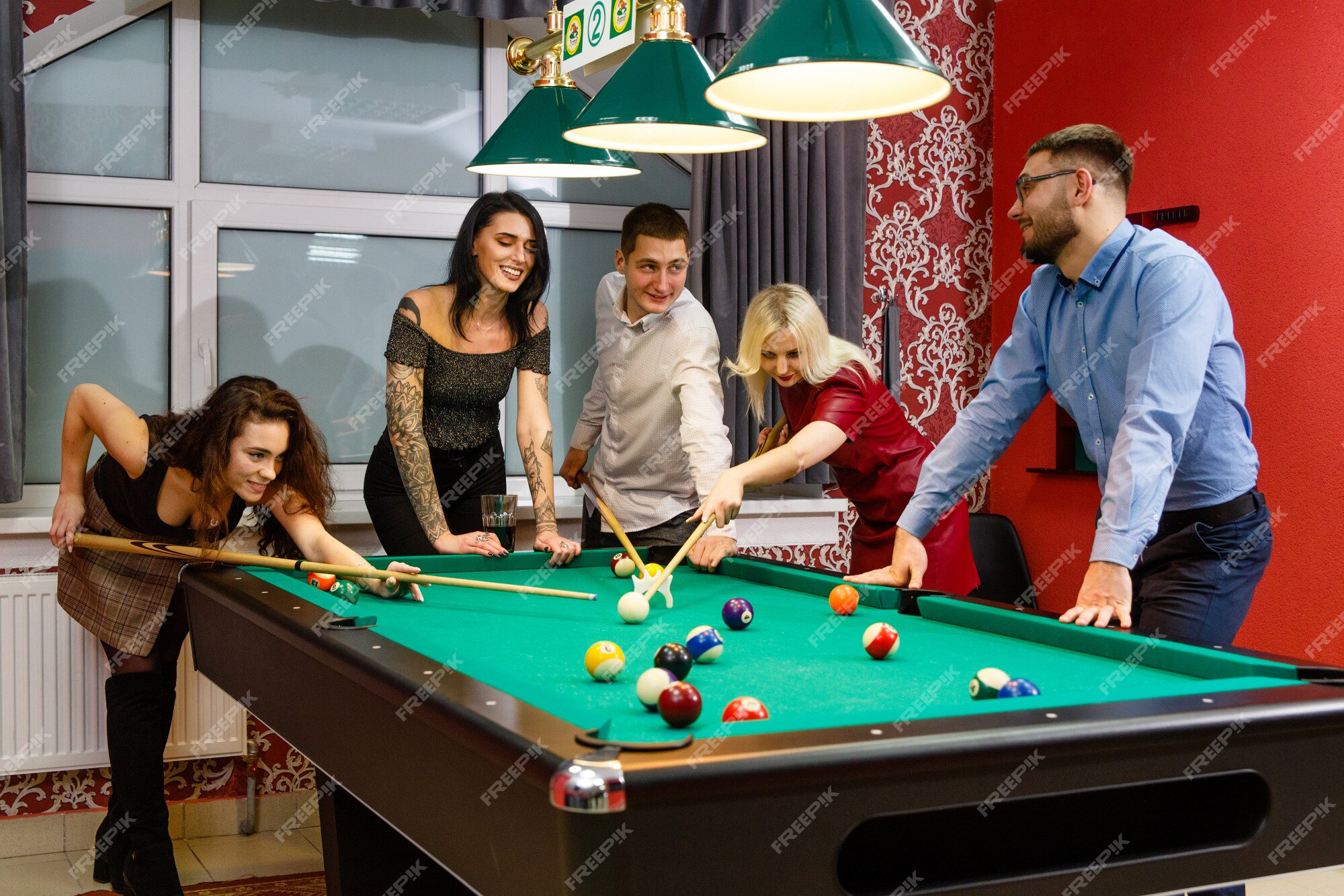 Group of young friends playing billiard 945174 Stock Photo at Vecteezy