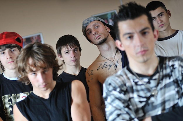 group of young happy boys posing  together in dence studio