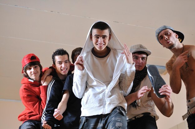 group of young happy boys posing  together in dence studio