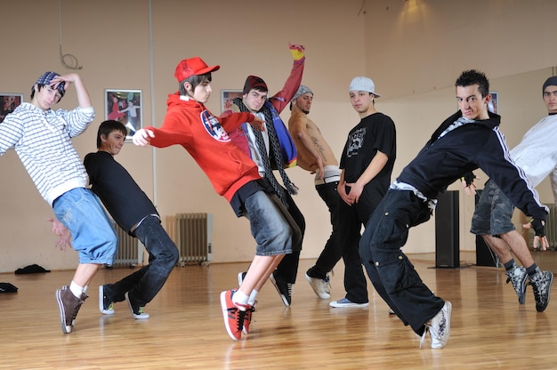 group of young happy boys posing  together in dence studio