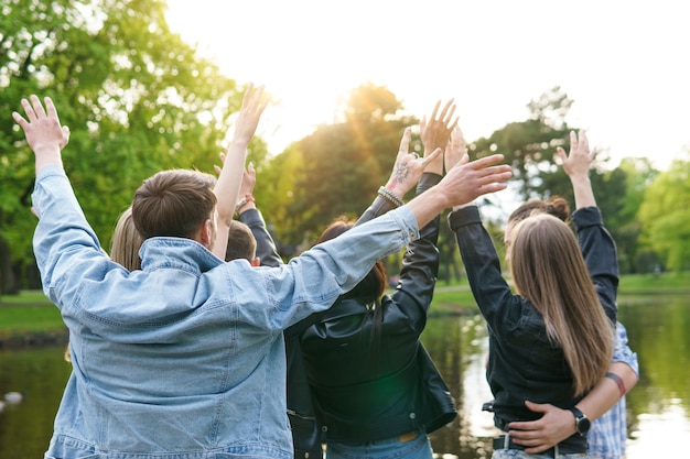 Group of young and happy friends enjoying freedom in a city park