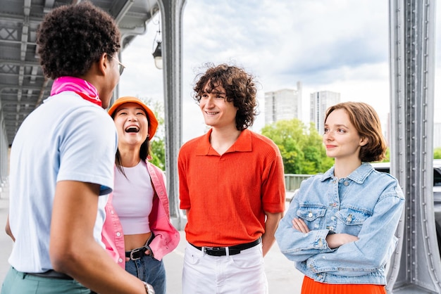 Group of young happy friends visiting Paris and Eiffel Tower