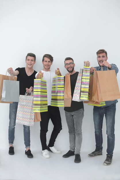 Group of young men shows shopping bags photo with copy space