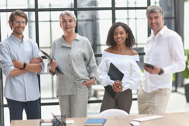 Photo a group of young modern people in smart casual clothes studying while working in the office