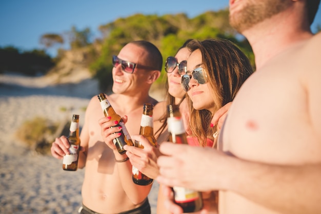 group of young multiethnic friends beach summer