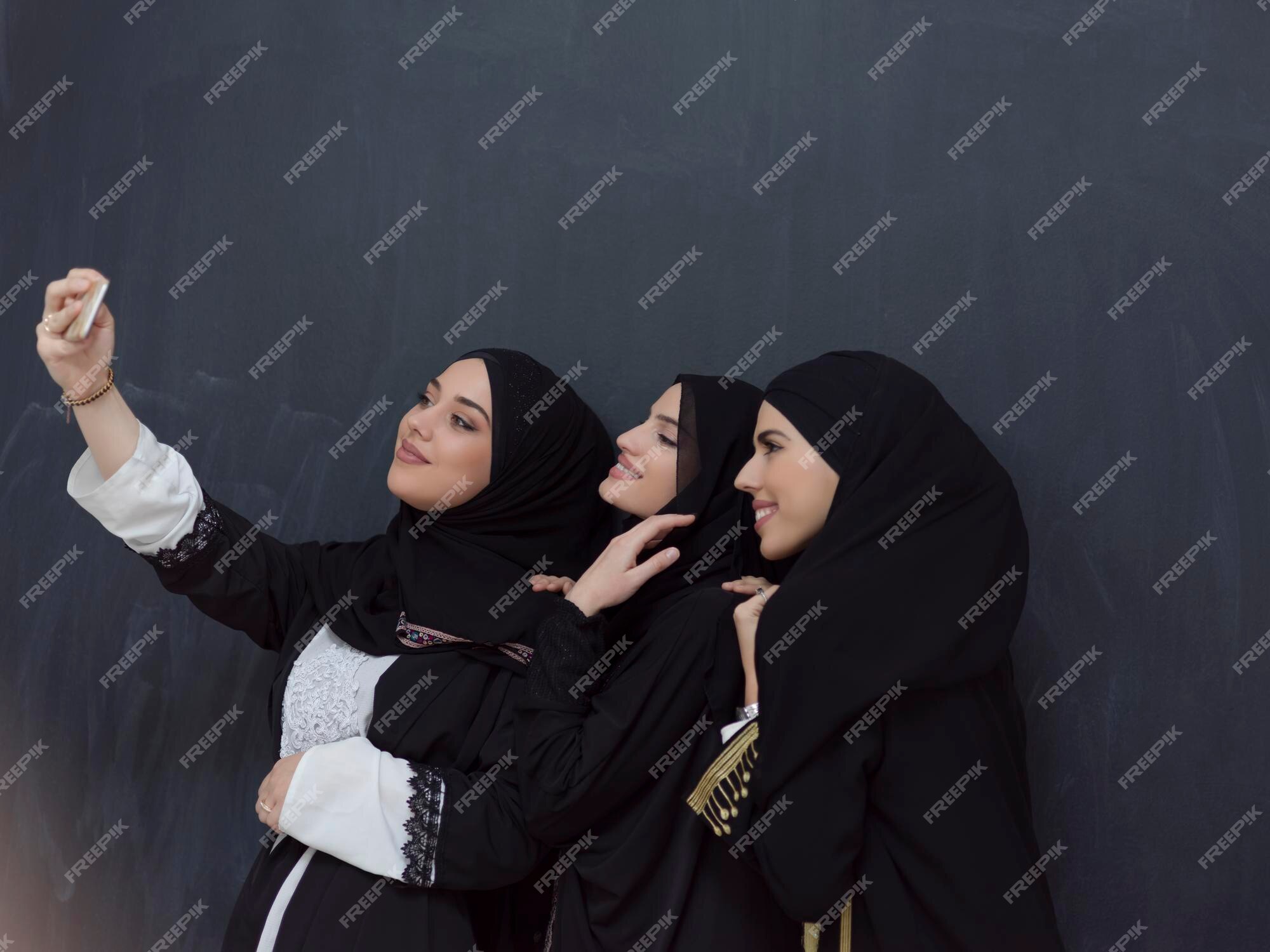 Premium Vector  Young muslim woman wearing hijab taking selfie