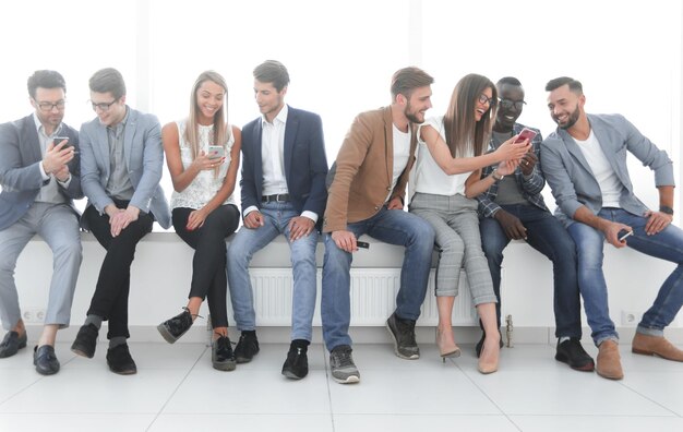 Group of young people communicate in the waiting room