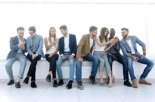 Group of young people communicate in the waiting roomphoto with copy space