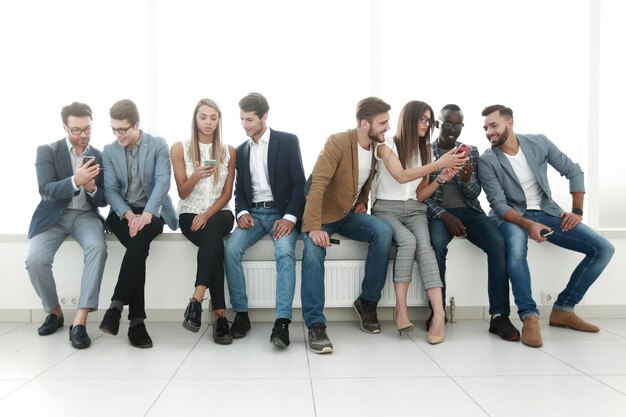 Group of young people communicate in the waiting roomphoto with copy space