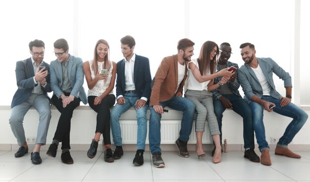 Group of young people communicate in the waiting roomphoto with copy space